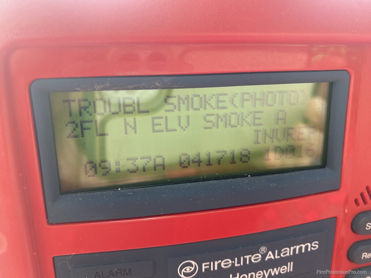 Fire-Lite Alarms panel displaying a smoke detector trouble condition