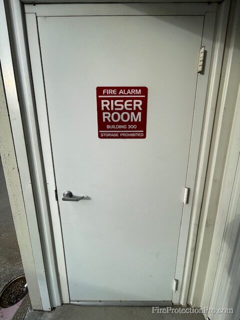 Riser room door with required signage and storage prohibition notice